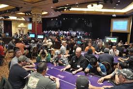 Two poker players fight inside Harrah's New Orleans poker room.